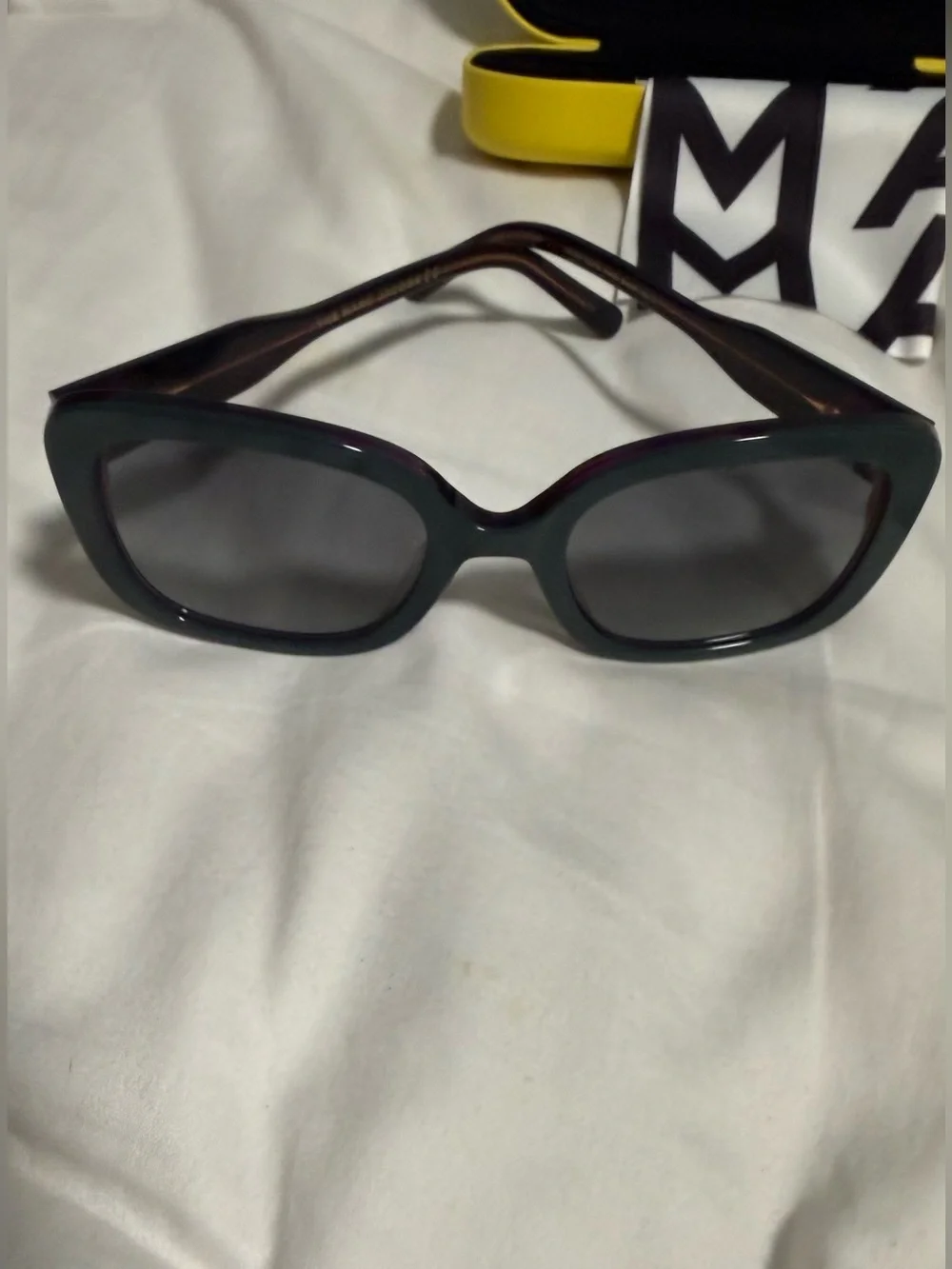 Marc Jacobs Woman’s Dark Teal Square Sunglasses with alternating pink hues! New